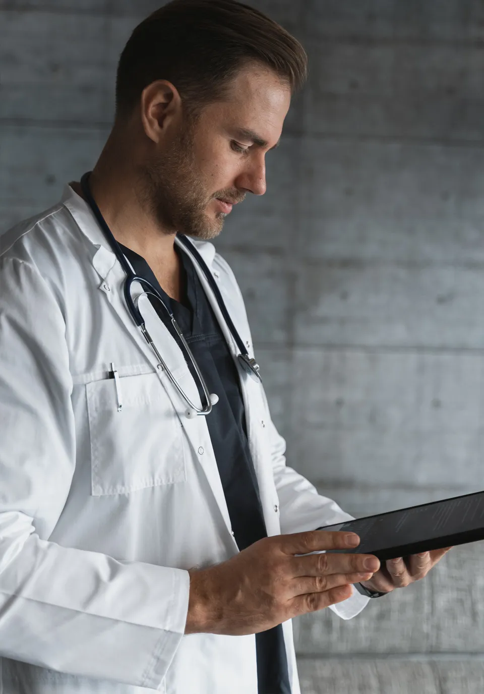 Doctor reviewing patient notes on a tablet